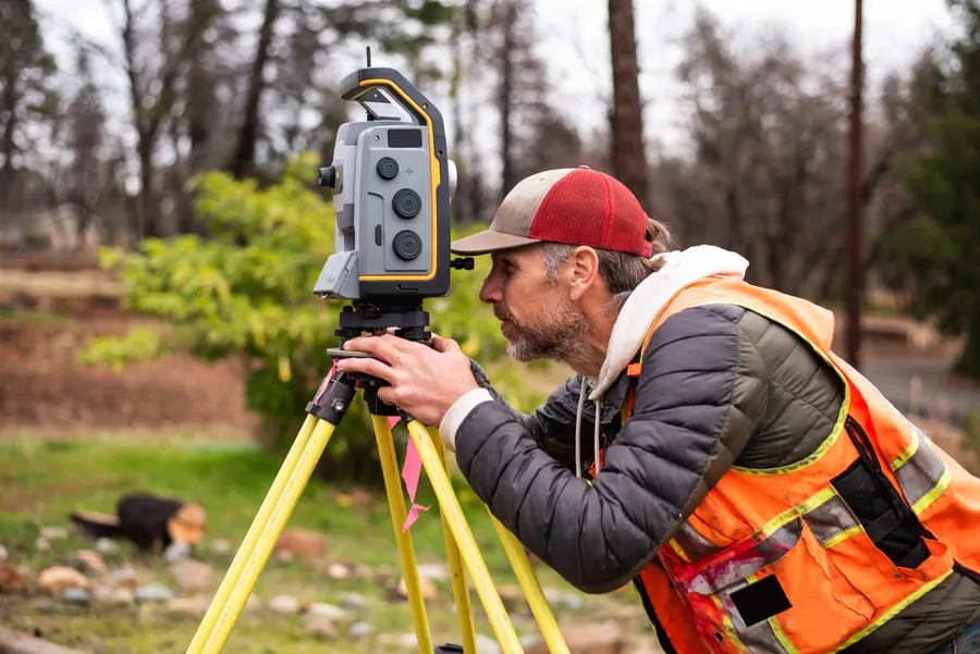 Surveying engineer working with a theodolite
